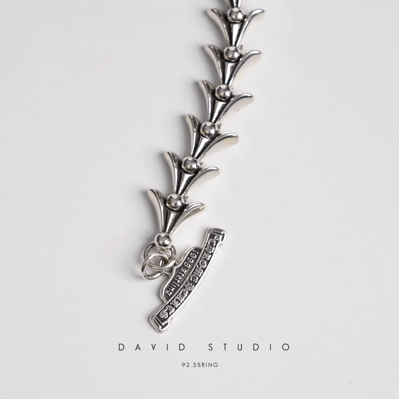 CROSSTAIL BRACELET WITH LOGO TAG