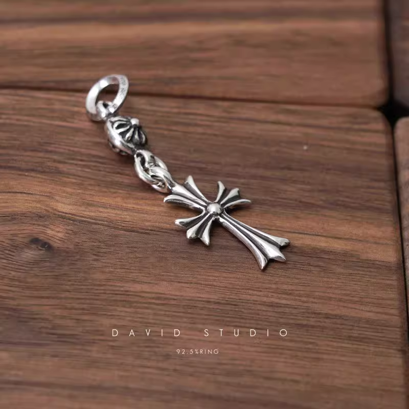 TINY CH CROSS WITH ONE SILVER BALL CHARM