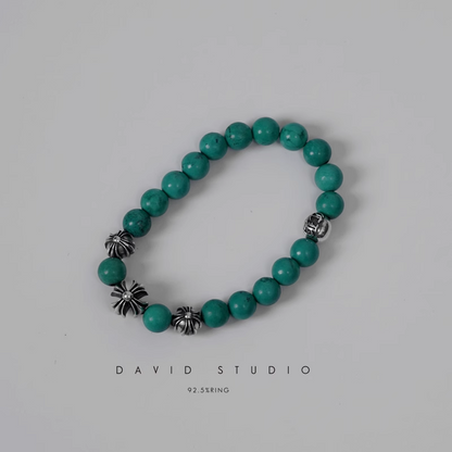 TURQUOISE BEAD BRACELET 8MM (4 SILVER BEADS)