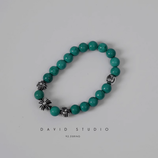 TURQUOISE BEAD BRACELET 8MM (4 SILVER BEADS)
