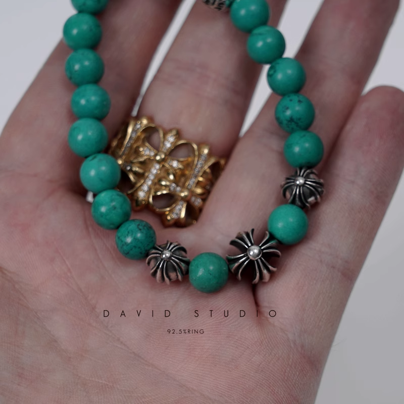 TURQUOISE BEAD BRACELET 8MM (4 SILVER BEADS)