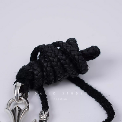 SMALL CROSS PENDANT WITH BAIL – LEATHER BRAID