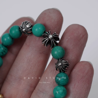 TURQUOISE BEAD BRACELET 8MM (4 SILVER BEADS)