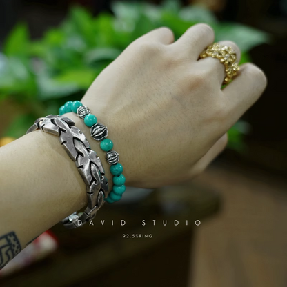 TURQUOISE BEAD BRACELET 8MM (4 SILVER BEADS)