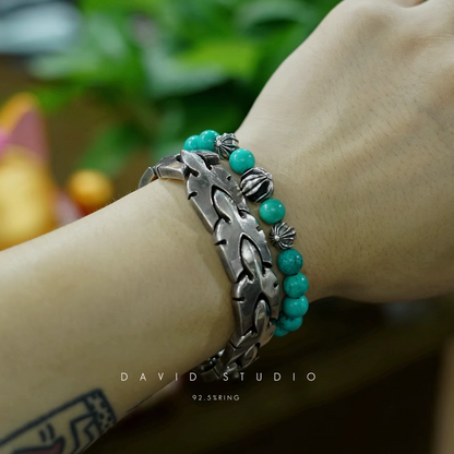 TURQUOISE BEAD BRACELET 8MM (4 SILVER BEADS)
